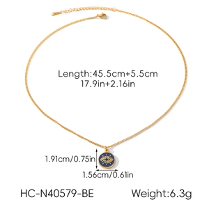 Detailed view of evil eye pendant with dimensions 1.91x1.56cm and 45.5cm chain length