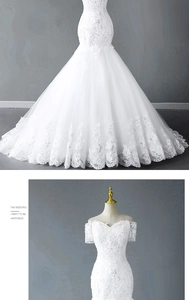 Close-up of white lace fishtail wedding dress with off-shoulder floral embroidery details