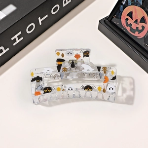 Detail of square hair claw clip with Halloween ghost bat spider and maple leaf prints