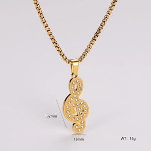 Detailed size view of a gold treble clef pendant necklace with cubic zirconia stones