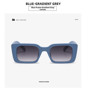 Front view of square blue sunglasses with gradient grey lenses and matte finish frames