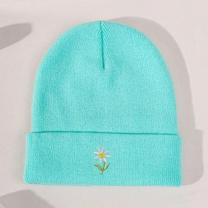 Mint green knitted beanie with small daisy flower embroidery and wide folded cuff design