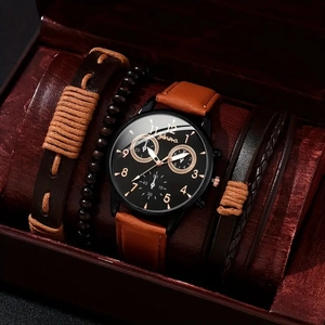 Close-up of Geneva watch set with brown leather strap and stylish beaded bracelets in a box