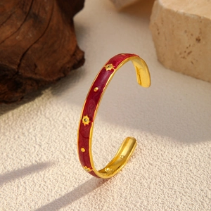 Luxury 18K gold plated open bangle with red enamel stars and sparkling zircon accents