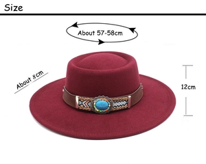 Detail of burgundy wool fedora featuring a leather band with turquoise stone and beads