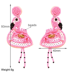 Pink beaded flamingo earrings showing 93mm height and 40mm width dimensions