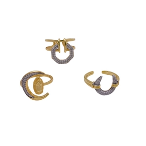 Three-piece 18K gold plated geometric open rings set with zircon stones on white background