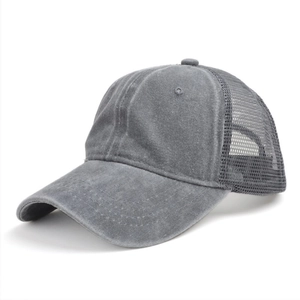 Detail view of washed grey cotton canvas and breathable mesh on retro trucker hat