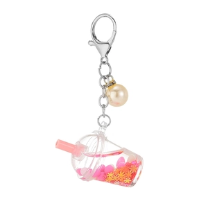 Creative bubble tea keychain with pink liquid and silver chain on a white background
