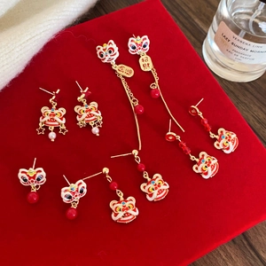 Traditional Chinese lion dance tassel earrings in red and gold with lucky character details