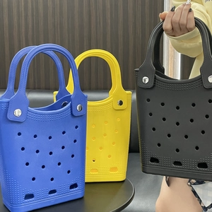 Three colorful EVA tote bags with perforated holes showing blue, yellow and black options