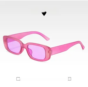 Close-up of retro square purple sunglasses with translucent frames and purple lenses