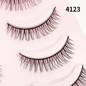 Detail view of model 4123 natural black false eyelashes on pink tray for daily makeup