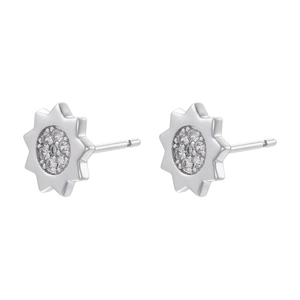 Macro detail of silver octagonal star stud earrings with pave-set clear zircon crystals