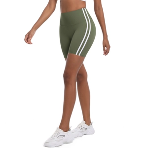 Detail view of high-waisted olive yoga shorts featuring dual white side stripes and stretch fit