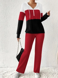 Detail of color-block hooded sweatshirt with ribbed texture and half-zipper design