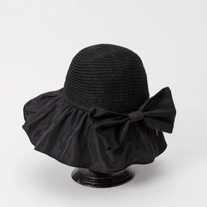 Detail of black sun hat with large side bow and textured knit crown for sun protection