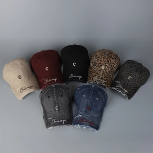 Selection of vintage baseball caps with leopard print and embroidered Chicago text details