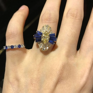 Vintage 18K gold plated ring with yellow zircon and sapphire accents on hand
