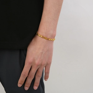 Golden stainless steel box link bracelet shown on wrist for styling and fit details