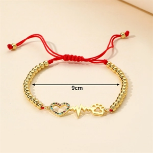 Adjustable red braided rope bracelet with colorful zircon heart and paw print charms