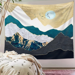 Detailed view of modern mountain art tapestry with gold and blue peaks in a cozy bedroom