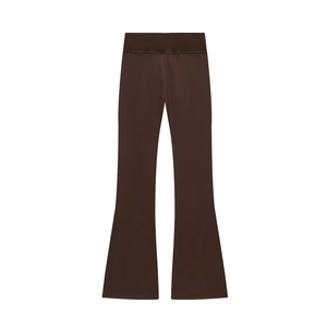 Detail of high-waisted dark brown flared trousers in premium elastic knit fabric