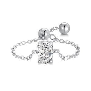 Adjustable silver chain ring with oval-cut clear zircon stone on a white background