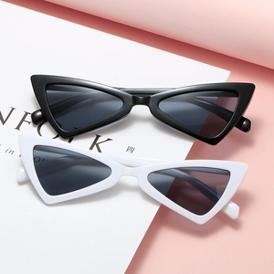 Retro cat-eye triangle sunglasses in black and white finish on a stylish pink background