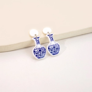 Macro detail of Chinese blue and white porcelain pattern acrylic earrings