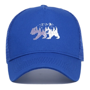 Navy blue trucker cap featuring forest bear embroidery and breathable mesh panels
