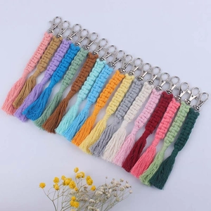 Close-up of colorful handmade braided cotton rope keychains with metal swivel clasps