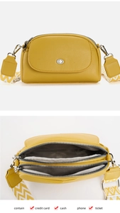 Detail of yellow dumpling bag with multiple compartments for phone and credit cards