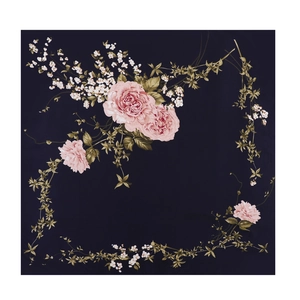 Detail of navy blue square scarf featuring pink roses and white floral botanical patterns