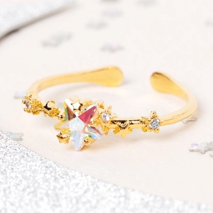 Adjustable 18K gold star ring with iridescent center stone and micro-pave crystals