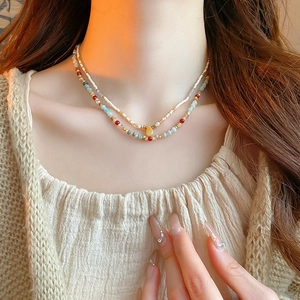 Double-layered colorful bead necklace with pearl strand and yellow teardrop pendant