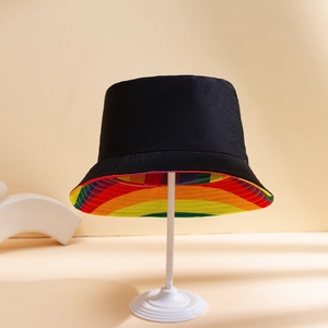 Detail showing the colorful rainbow striped lining inside the black cotton bucket hat