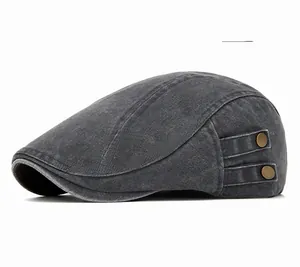 Detail of vintage washed gray cotton newsboy cap with bronze metal buckle accents