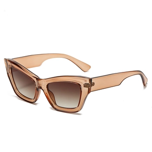 Classic amber cat-eye sunglasses with gradient lenses on a clean white background