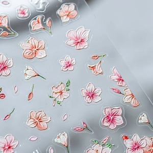 3D floral nail art stickers with pink embossed cherry blossoms on transparent film