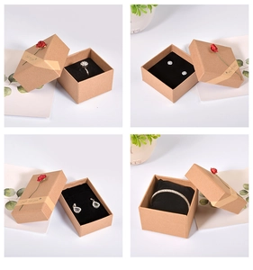 Detailed grid view of kraft paper jewelry gift boxes with ribbons and decorative roses