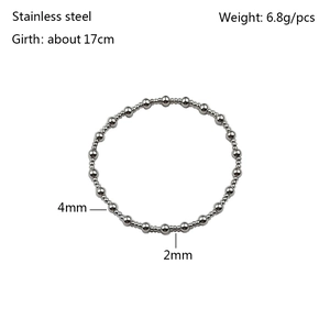 Macro detail of 4mm and 2mm stainless steel beaded stretch bracelet showing size specs