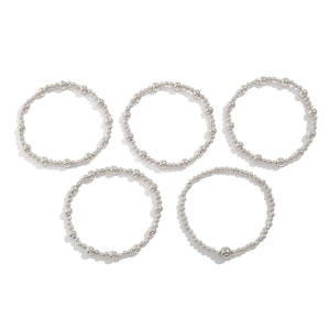 Detail view of 5-piece silver metal beaded bracelet set with various bead sizes