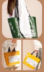 Detail of colorful woven shopping bags with durable straps and modern typography print