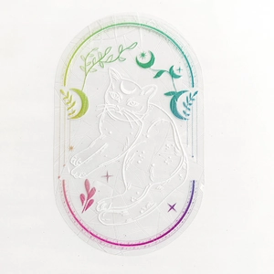 Detail of cat and moon suncatcher sticker with white embossed lines and rainbow gradient