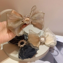 Detailed look at three elegant lace bow hair clips with sparkling rhinestone centers