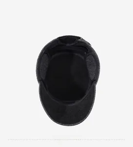 Detailed inner view of warm earflap hat for men featuring thick lining and neat stitching
