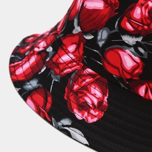 Retro bucket hat with red rose pattern and durable twill fabric on black background