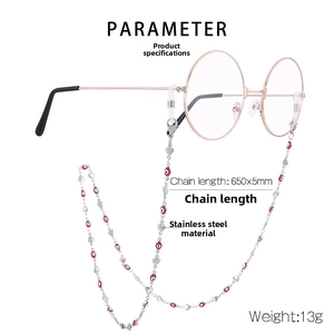 Detail of stainless steel eyewear chain with red evil eye beads and heart charms