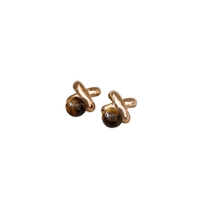 18k gold plated X-shaped stud earrings with round tiger eye stones in minimalist style